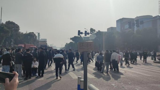 Workers in China clash with police after reported layoffs at Covid test maker